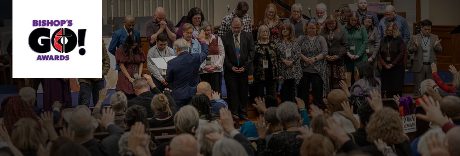 Large crowd praying over leaders at Go Awards 2026